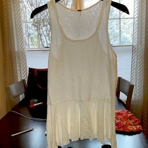 Free people. See-through top with ruffle bottom. Size medium